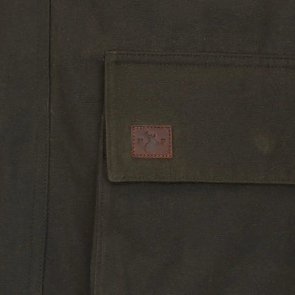 Olive green pocket with brown label on New Forest Woodsman Wax Jacket for forest woodsman style