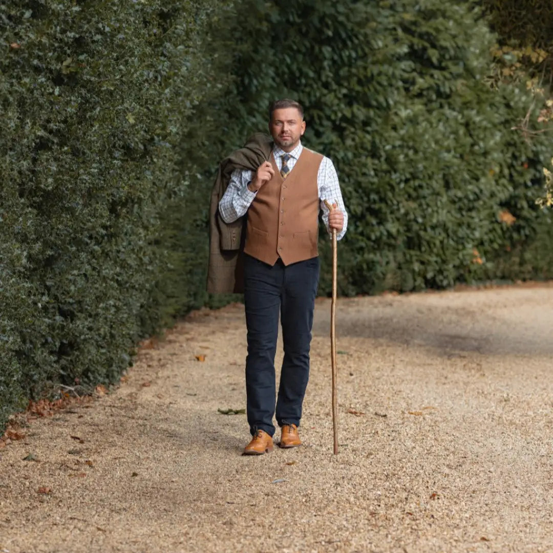 Man in brown vest with walking stick wearing New Forest Wool Mix Waistcoat