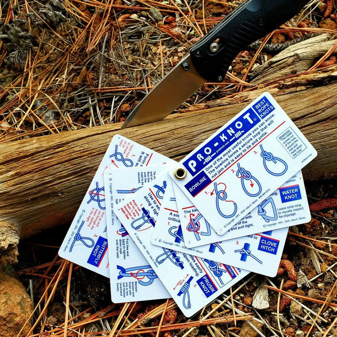 White plastic outdoor knots cards with blue diagrams showing trucker’s hitch and tautline hitch
