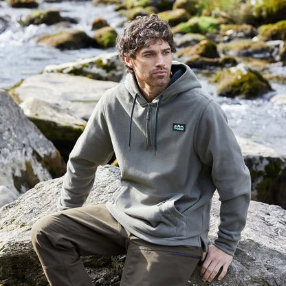 Man wearing olive green Ridgeline Ballistic Hooded Fleece hoodie for outdoor adventures