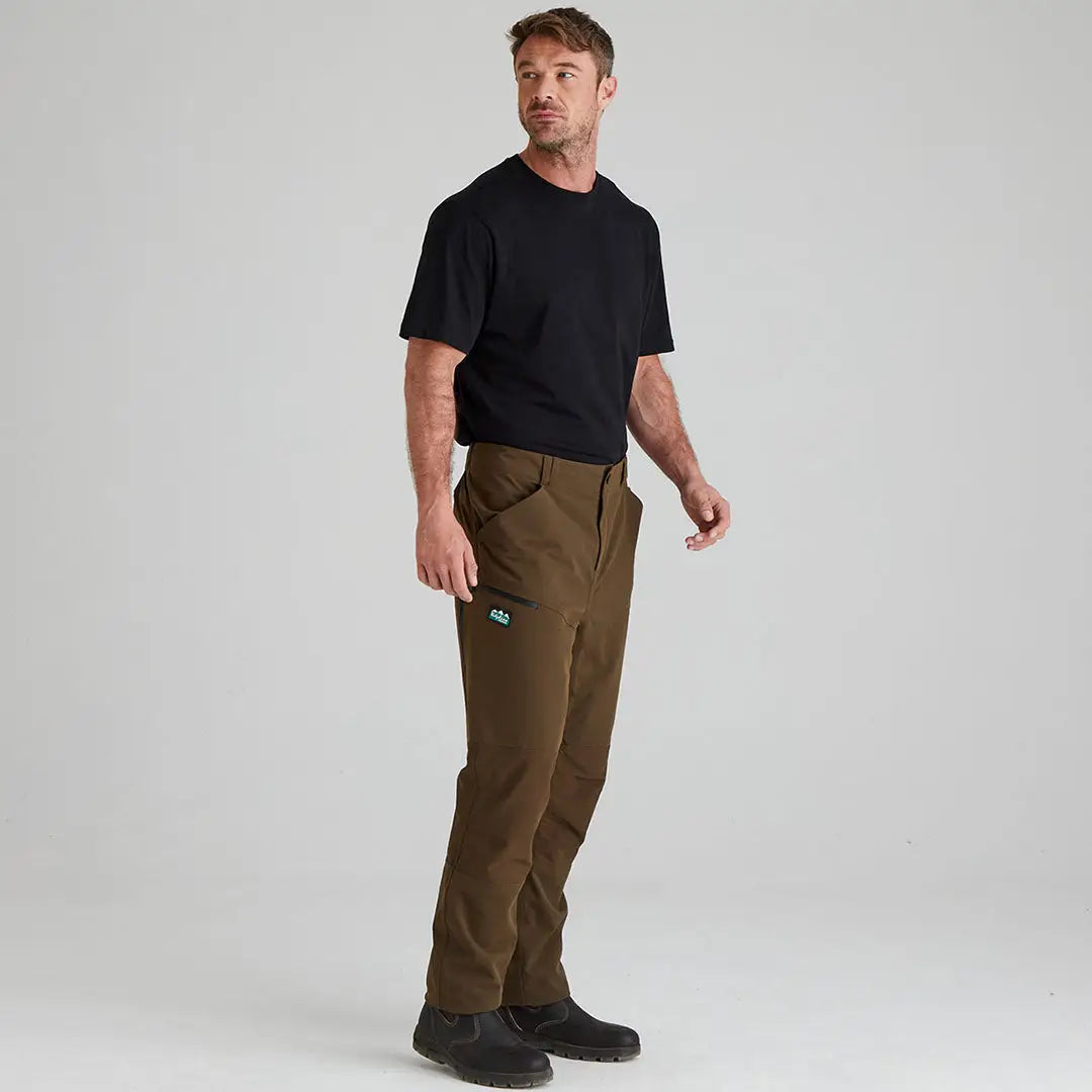 Man in Ridgeline Cambrian Trousers and black t-shirt, perfect for extreme weather conditions