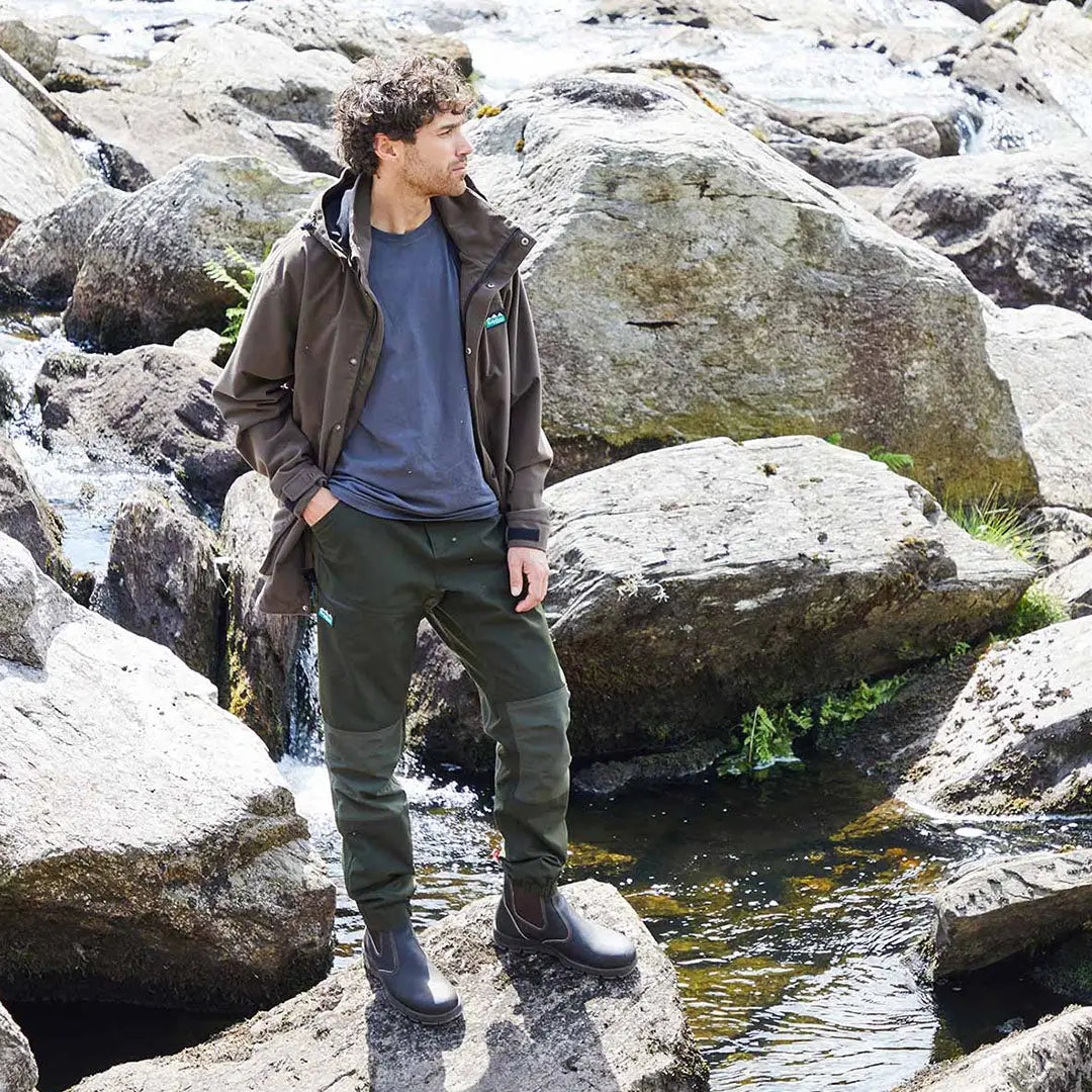 Man in outdoor clothing wearing Cambrian Trousers perfect for extreme weather conditions