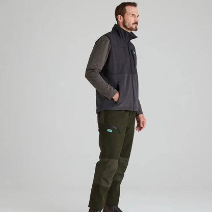 Man wearing Ridgeline Hybrid Fleece Gilet with gray vest and green pants, arms moving freely