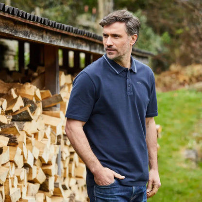 Man wearing Ridgeline Kilworth Polo Top in navy for that casual look