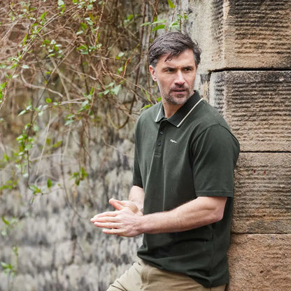 Man in green Ridgeline Kilworth Polo Top showcasing stylish kilworth polo design