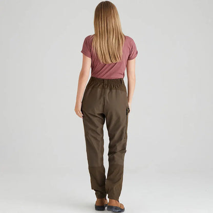 Woman in brown cargo pants and mauve T-shirt showcasing Ridgeline Ladies Cambrian Trousers perfect for harsh weather