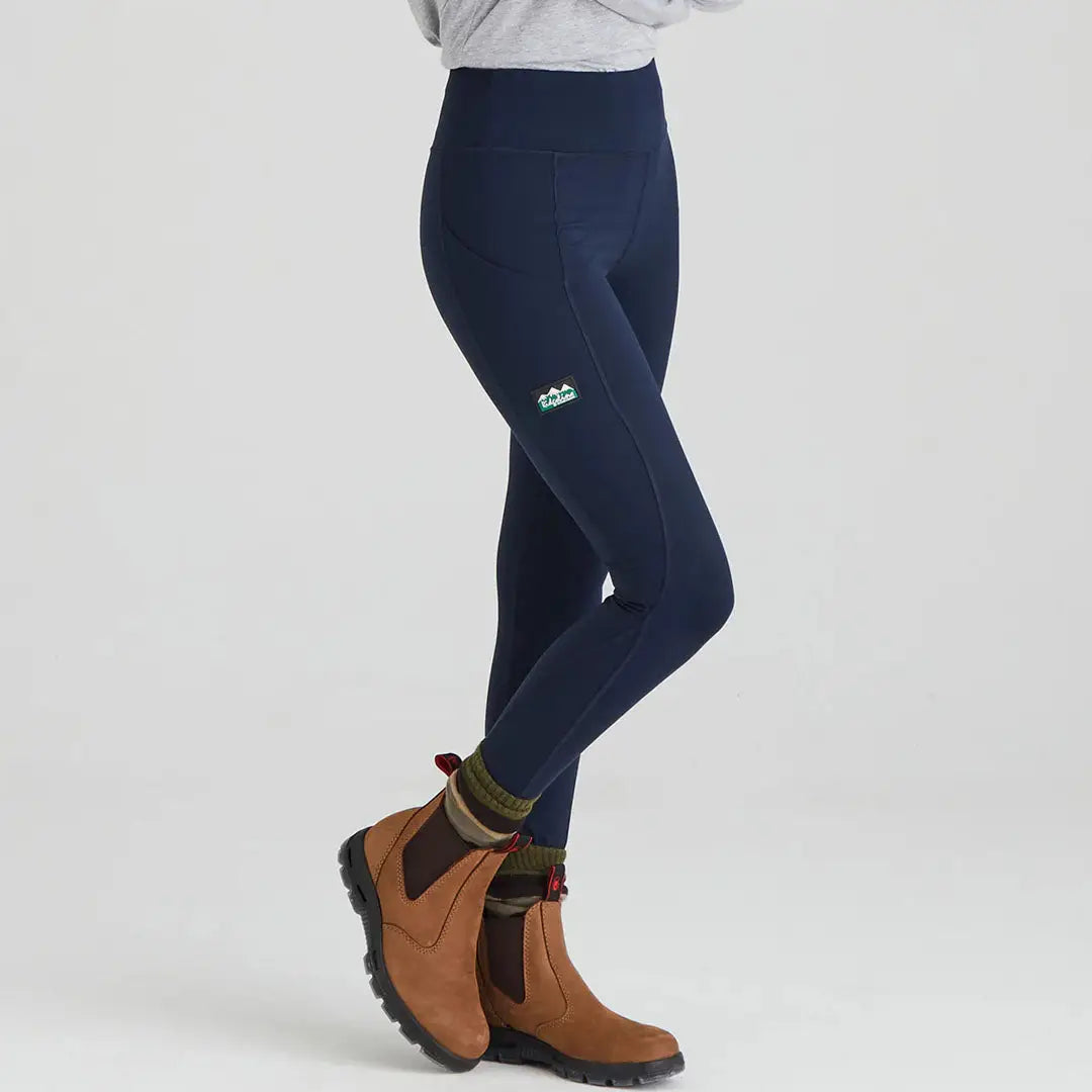 Navy Ridgeline Ladies Infinity Leggings paired with brown boots for a stylish look