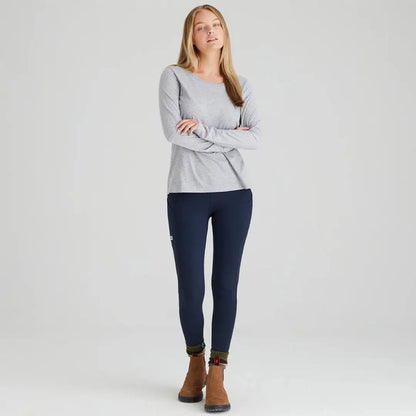 Woman wearing Ridgeline Ladies Infinity Leggings in gray long-sleeved shirt and navy leggings