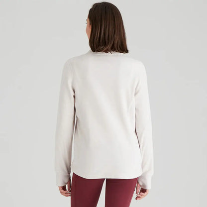 Woman wearing a long-sleeved beige Ridgeline Ladies Narvik Fleece made of highly functional polyester fleece