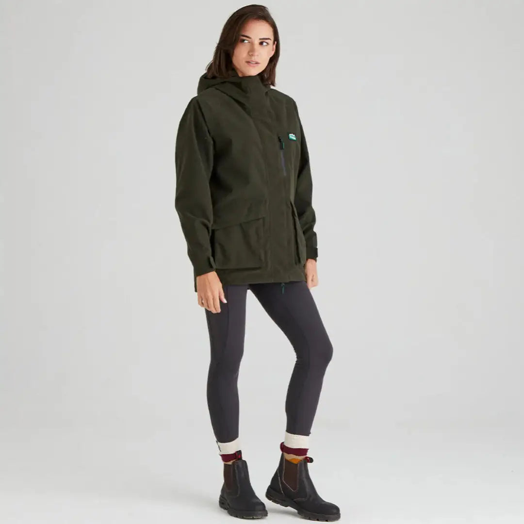Woman in dark green Ridgeline Ladies Rhea Jacket and leggings outdoors