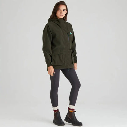 Woman in dark green Ridgeline Ladies Rhea Jacket and leggings outdoors