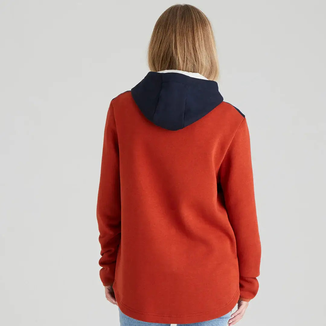 Woman’s rust-colored hooded sweatshirt from the Ladies South Island Hoodie collection