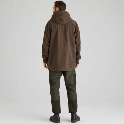 Man in brown hooded jacket and green pants wearing Ridgeline Torrent III Jacket for country clothing