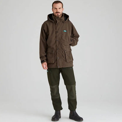 Man wearing Ridgeline Torrent III Jacket and green pants, perfect for country clothing