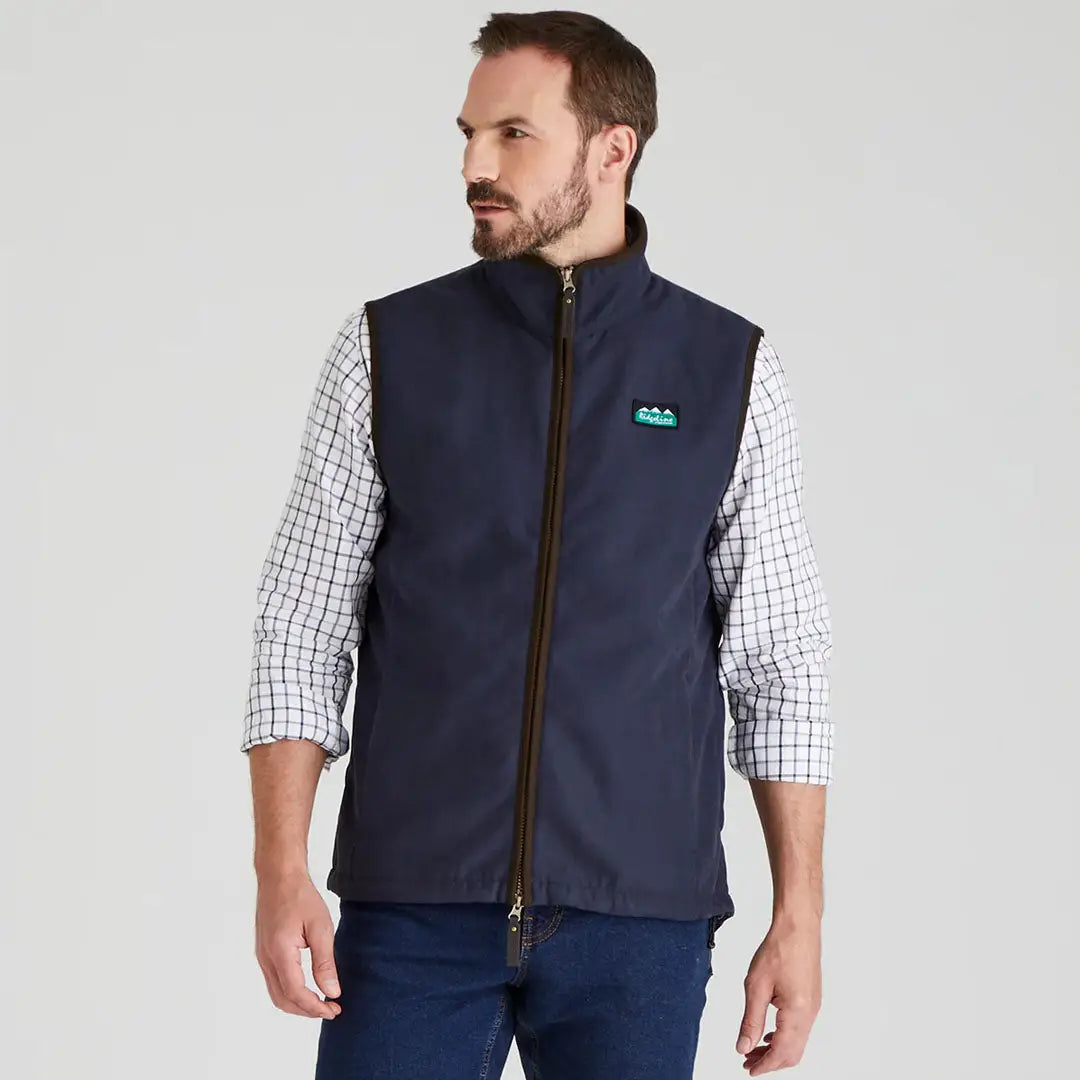 Man wearing a navy Ridgeline Monarch Gilet in outdoor setting