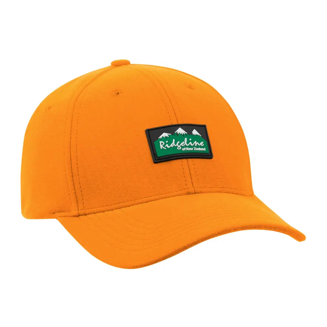 Orange Ridgeline Monsoon Classic Cap with green logo and adjustable strap outdoors