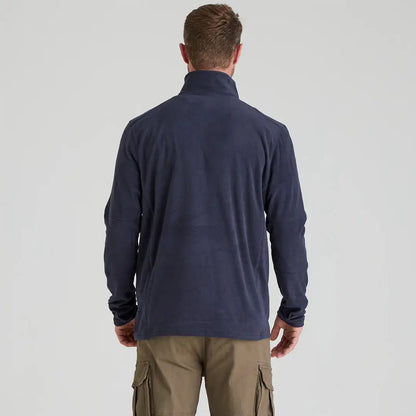 Man wearing Ridgeline Narvik Fleece navy jacket and khaki cargo pants, highly functional polyester fleece