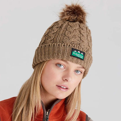 Woman wearing Ridgeline Nordic Fleck Bobble Hat with faux fur pom-pom, cozy fleck bobble hat style