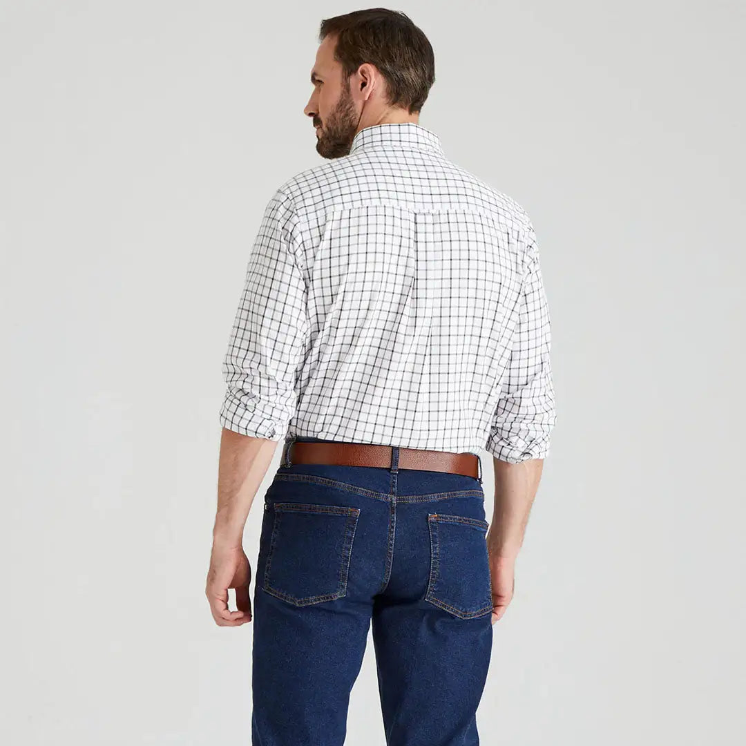 Man wearing a Ridgeline Sedgebrook Shirt in plaid with jeans for casual style