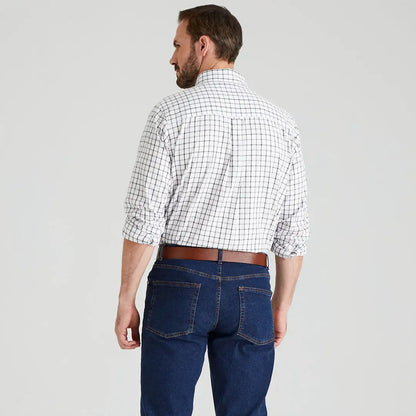 Man wearing a Ridgeline Sedgebrook Shirt in plaid with jeans for casual style