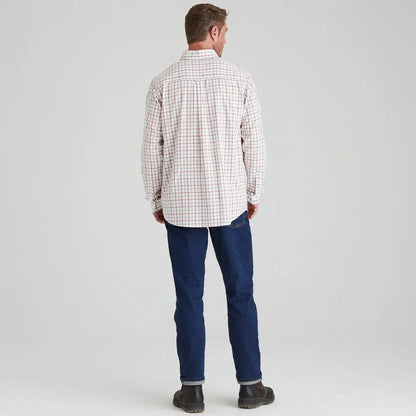 Man in plaid shirt and jeans wearing the Ridgeline Sedgebrook Shirt in a casual style