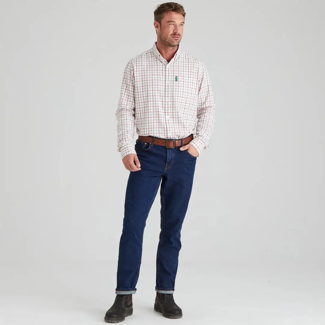 Man in plaid shirt and jeans wearing the Ridgeline Sedgebrook Shirt for casual style