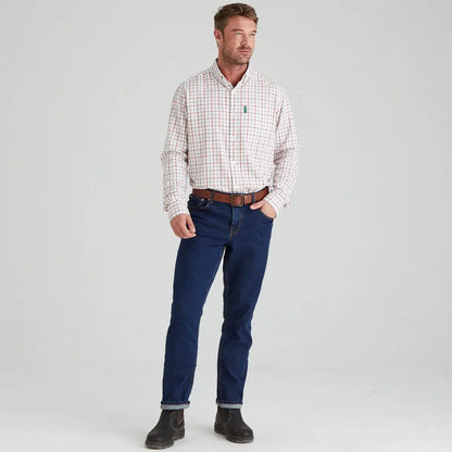 Man in plaid shirt and jeans wearing the Ridgeline Sedgebrook Shirt for casual style