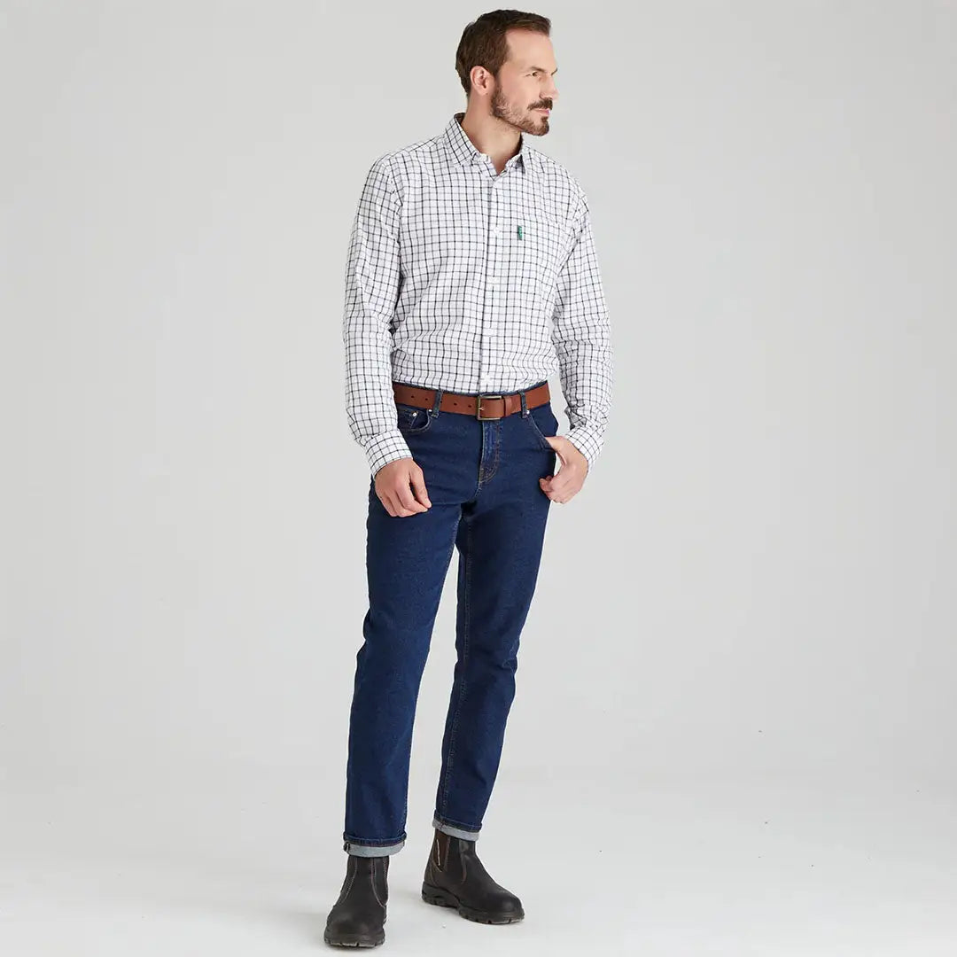 Man in a checkered Ridgeline Sedgebrook Shirt and jeans for casual style