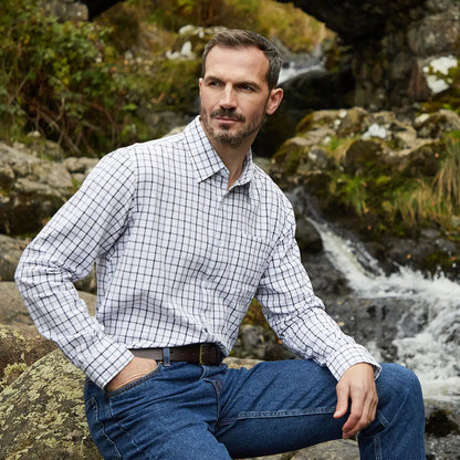 Man wearing Ridgeline Sedgebrook Shirt with jeans in a stylish checkered design