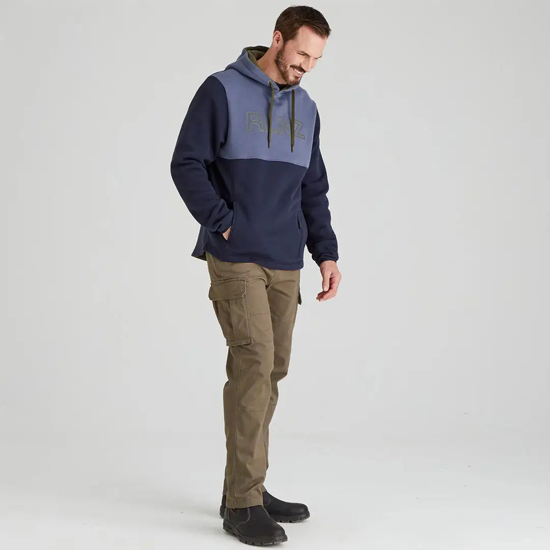 Man wearing a Ridgeline South Island Hoodie with cargo pants in outdoor setting