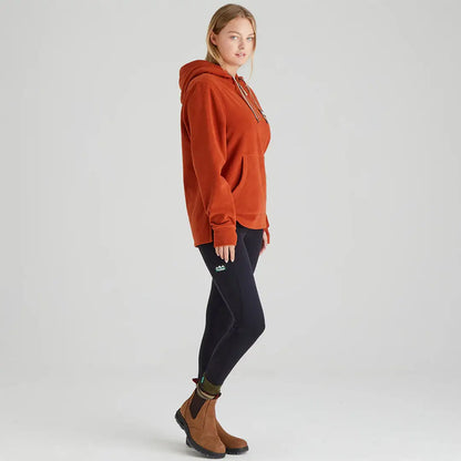 Woman wearing an orange Ridgeline Womens Ballistic Hoodie and black leggings