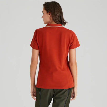 Woman wearing a rust-colored Ridgeline Womens Kilworth Polo Shirt, stylish polo shirt