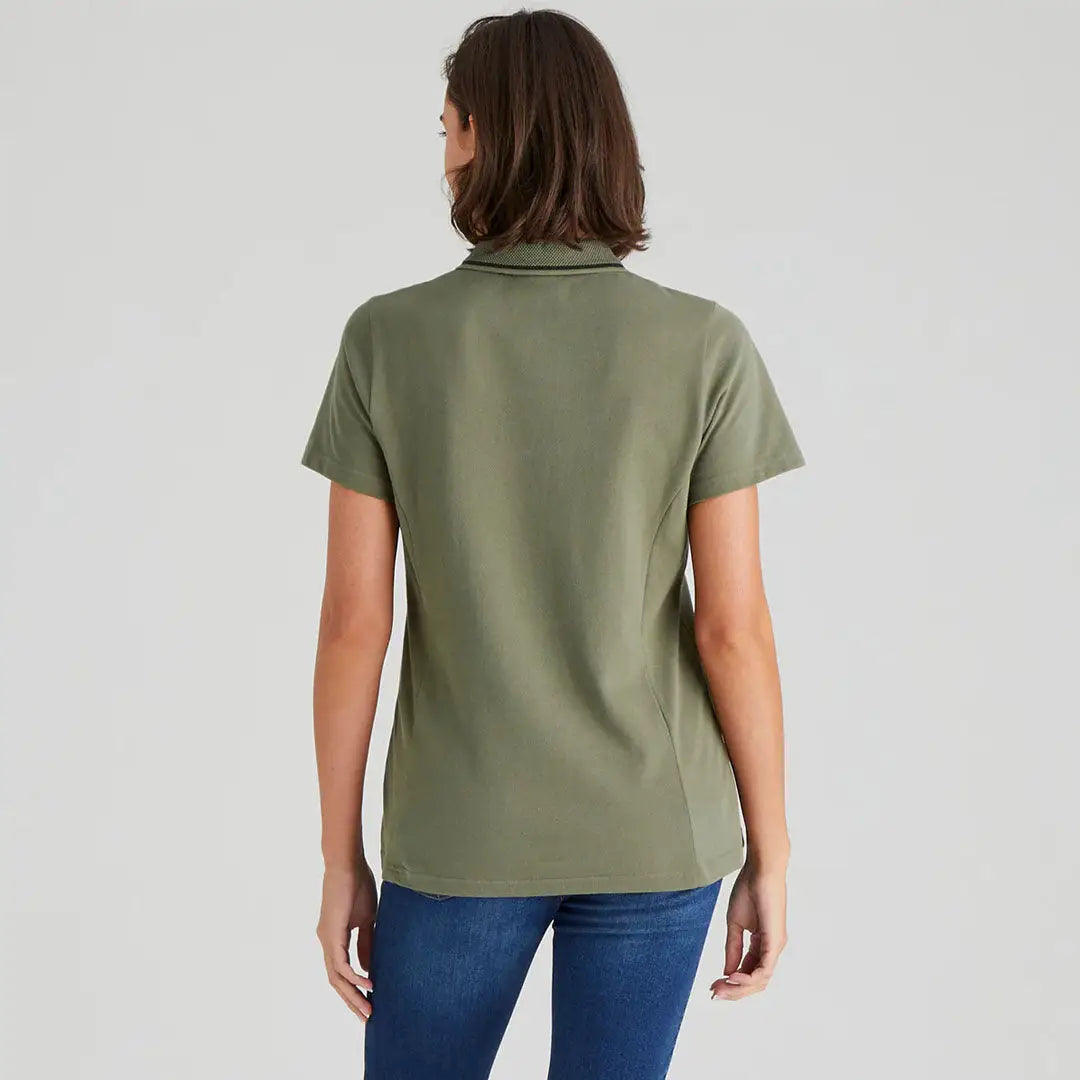 Woman wearing a green Kilworth Polo Shirt from the Ridgeline Womens Kilworth collection