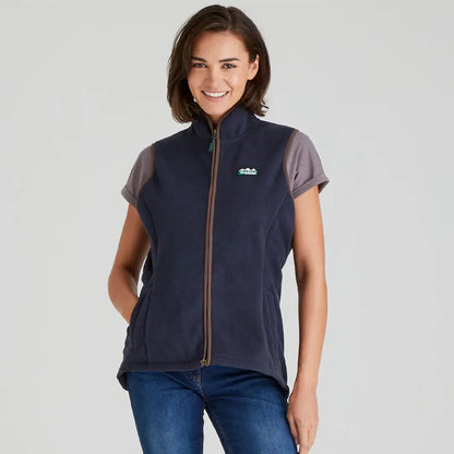 Woman wearing navy blue Ridgeline Womens Kodiak Gilet for outdoor adventures