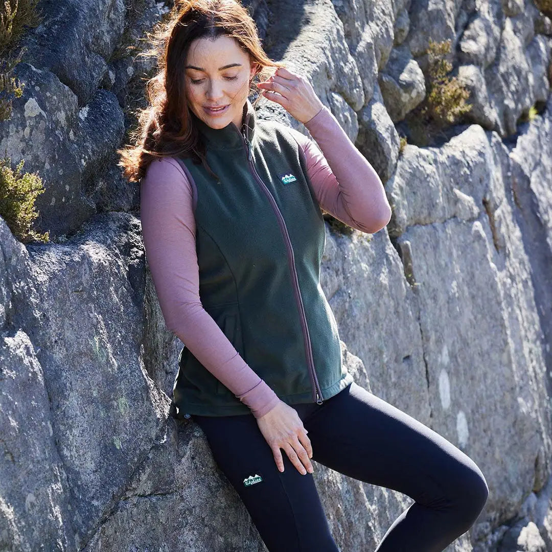 Woman wearing Ridgeline Womens Kodiak Gilet in green, perfect for superior southern outdoor adventures