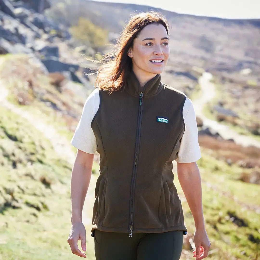 Woman’s brown fleece vest from Ridgeline Womens Kodiak Gilet, a luxurious southern star wind-resistant vest perfect for layering
