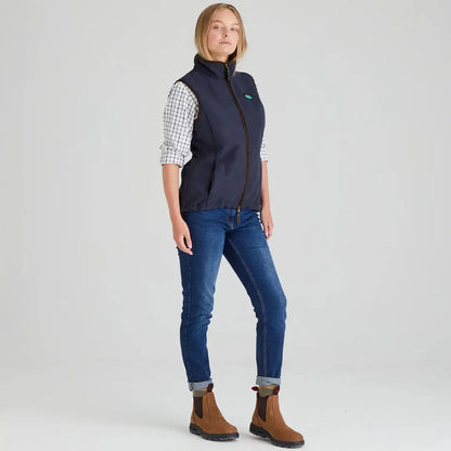 Woman wearing navy Ridgeline Womens Monarch Gilet with jeans and boots for outdoor style