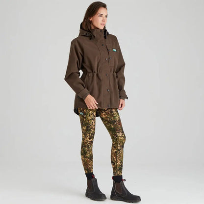 Woman in Ridgeline Womens Monsoon Classic Jacket with brown jacket and camouflage leggings