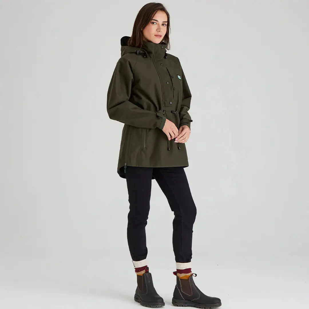 Woman wearing a green hooded Ridgeline Womens Monsoon Classic Smock in Deep Forest