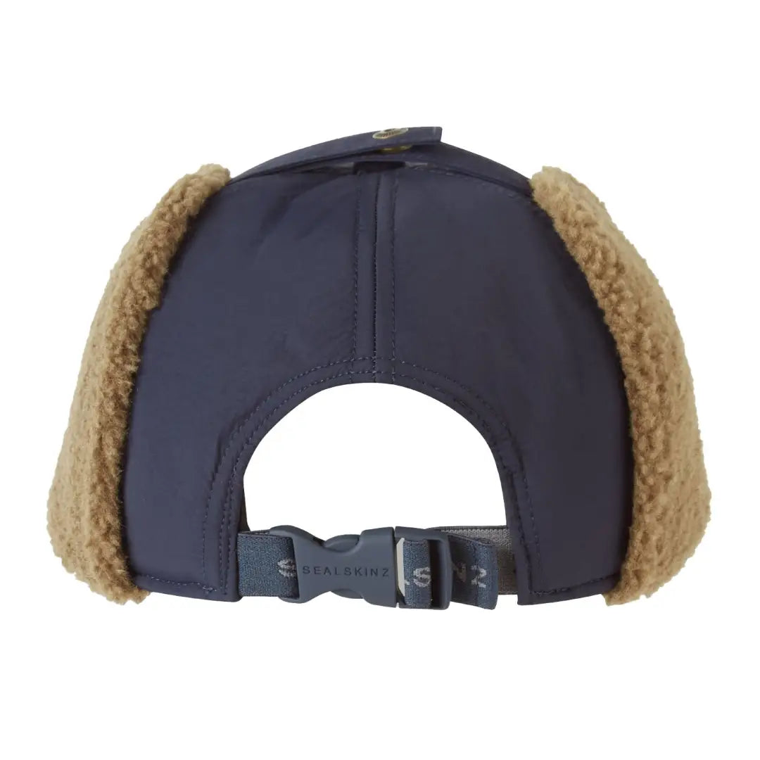Navy blue winter cap with tan faux fur ear warmer, perfect for hunting and country clothing