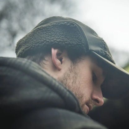 Man wearing a fur-lined hat showcasing the Seeland Canada Yukon Jacket outdoor style