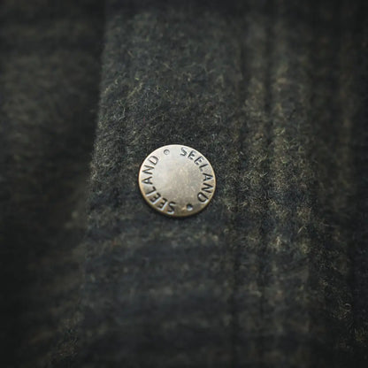Silver Seeland button on Canada Yukon jacket for outdoor adventures