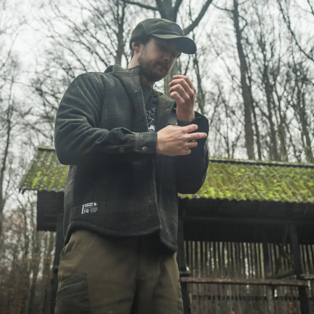 Man wearing the outdoor Canada Yukon Jacket in nature setting for the Yukon jacket product