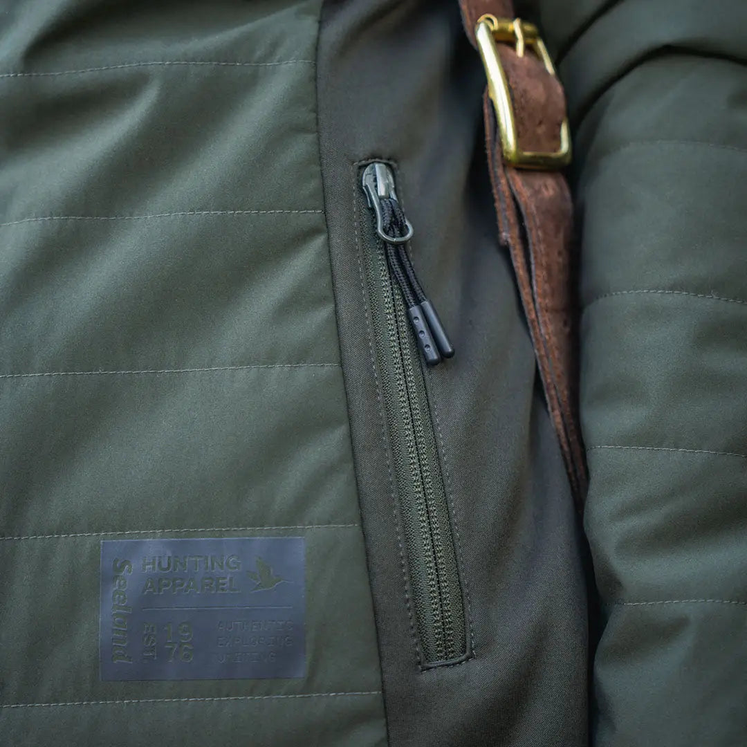 Olive green Celsius Aia heat jacket with quilted design and zipper pocket for women