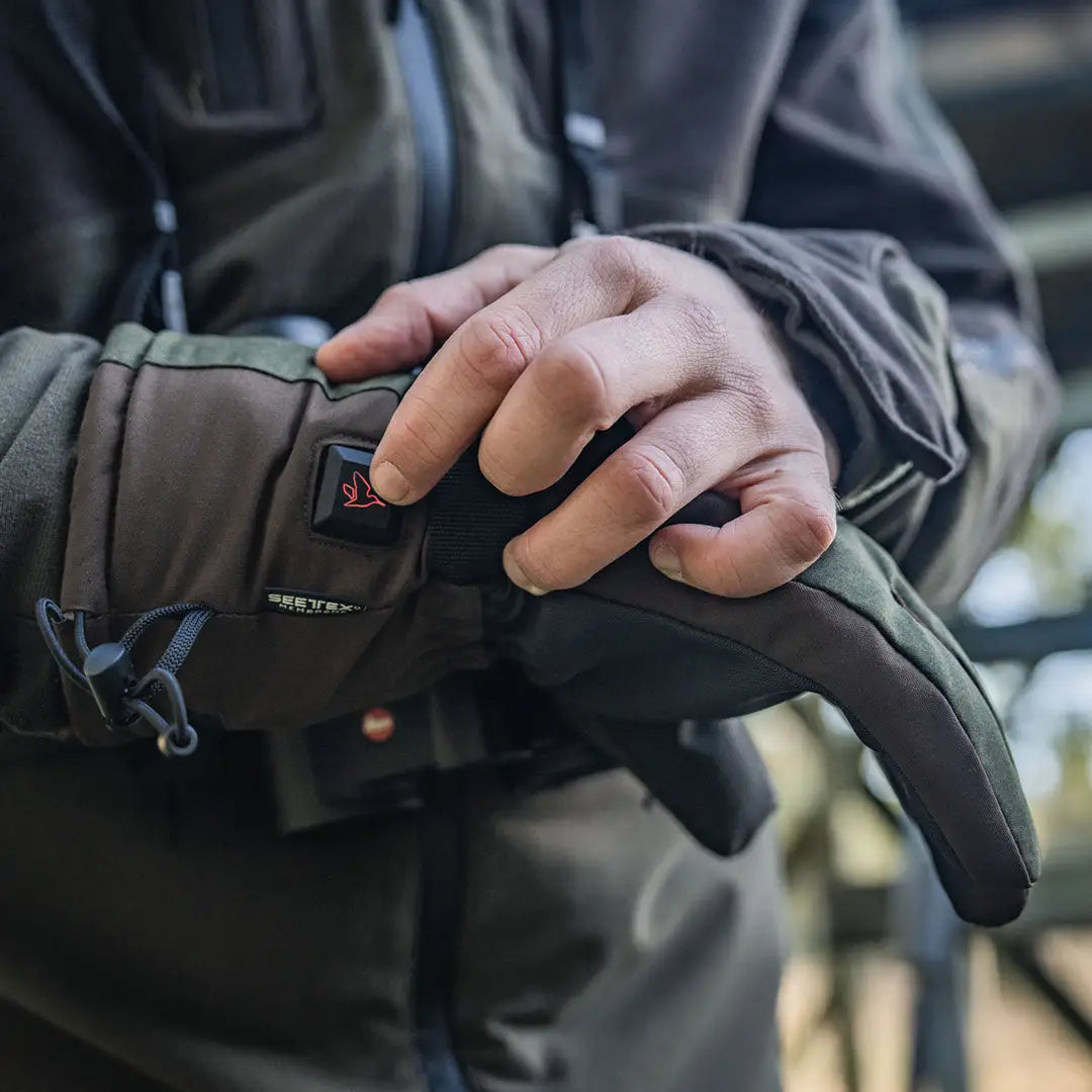Heated glove with power button showcasing Seeland Celsius Heat Gloves for warm hands
