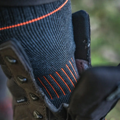 Seeland Celsius Heat Sock with black sock and orange stripes inside a country clothing boot