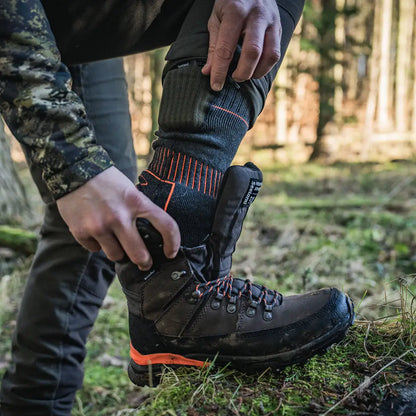 Brown hiking boot with orange accents for Celsius Heat and country clothing adventures