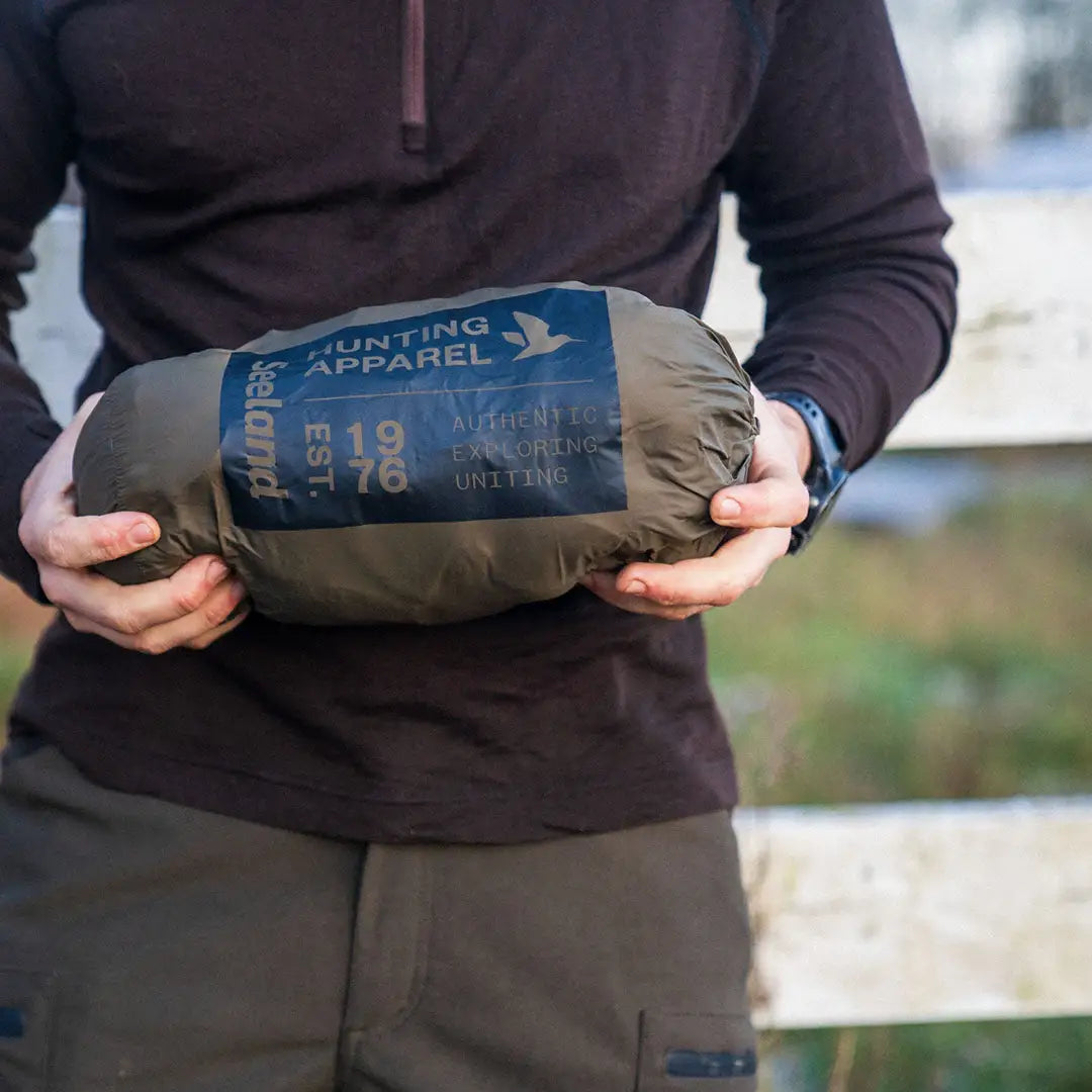 Rolled-up Seeland Fahrenheit hunting jacket with synthetic insulation and YKK zippers