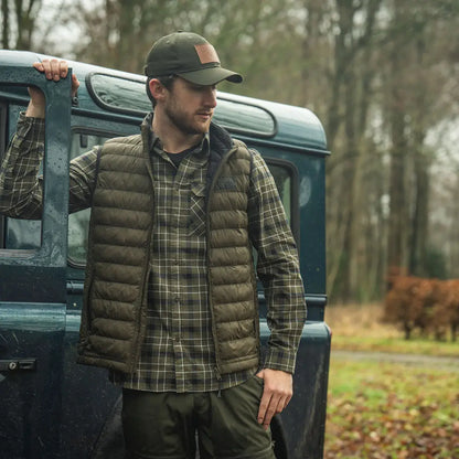 Man in outdoor clothing wearing Seeland Fahrenheit Waistcoat for hunting and country adventures