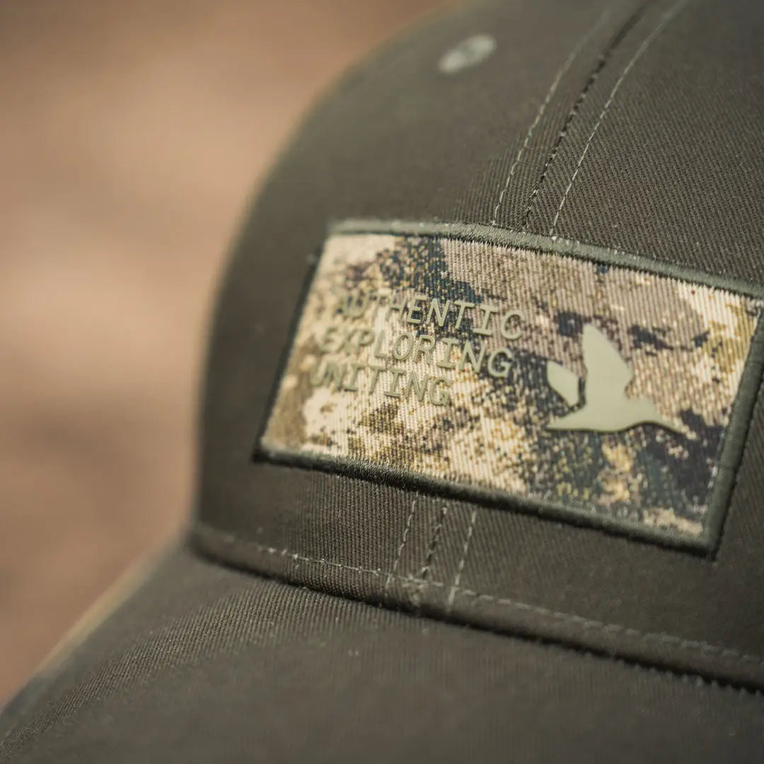 Olive green Seeland Ganister Trucker Cap with a cool camouflage patch
